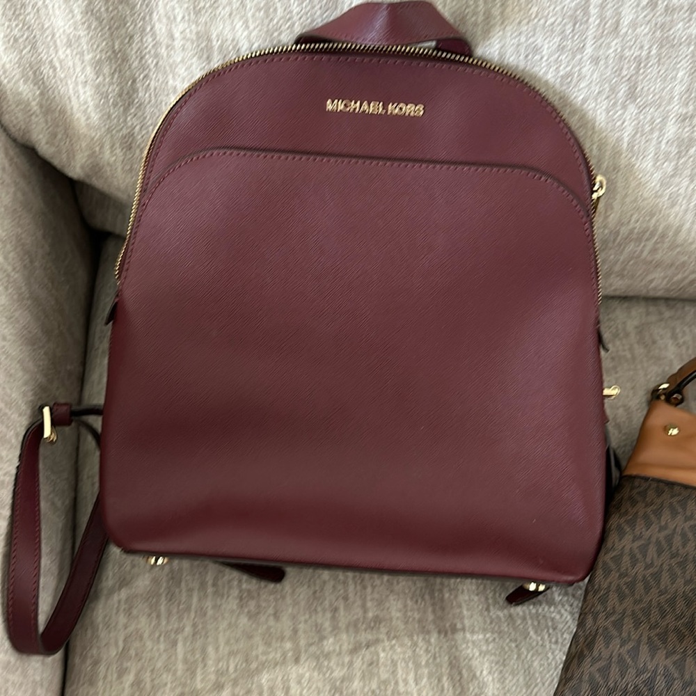 Micheal Kors burgundy backpack